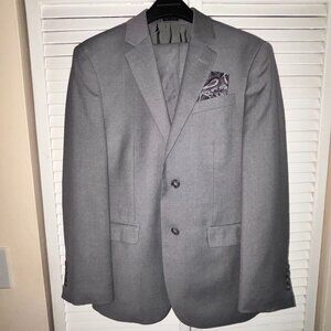 Young Men's tailored suit size 36 Jacket and 30 waist pants. Inseam of 26.